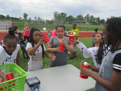 Elem Field Day  Ping Pong Ball Catch in Cup